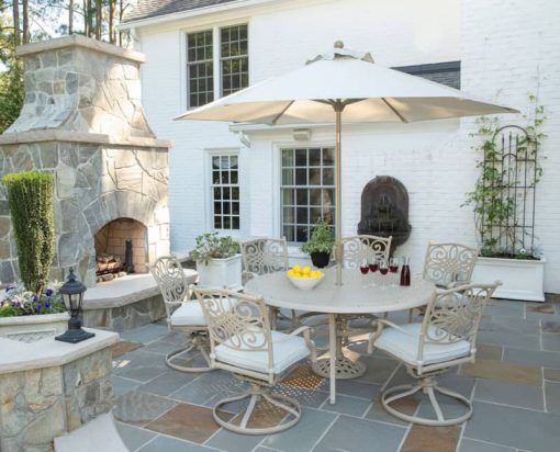 Hanover Traditions 7-Piece Outdoor Dining Set In Sand/Beige With 6 Swivel Rockers, 60" Round Cast Table, Umbrella, Base - Image 2