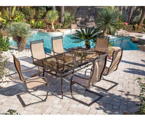 Hanover Monaco 7-Piece Outdoor Dining Set In Tan/Bronze With 6 Spring Sling Chairs, 42" x 84" Glass-Top Table - Image 2
