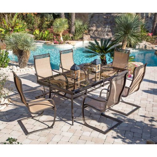 Hanover Monaco 7-Piece Outdoor Dining Set In Tan/Bronze With 6 Spring Sling Chairs, 42" x 84" Glass-Top Table - Image 3