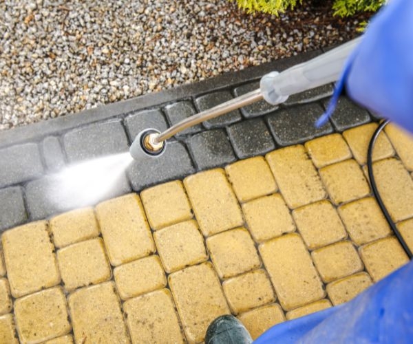 How do I maintain my driveway after pressure cleaning?