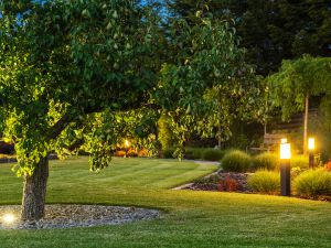 How do lights improve visibility for driveways and patios?